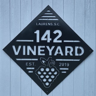 Custom 142 Vineyard metal sign installed on exterior wall