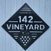 Custom 142 Vineyard metal sign installed on exterior wall