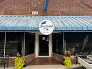 Custom salon sign installed over storefront entrance
